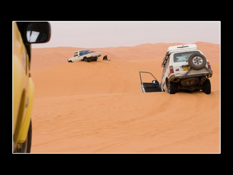 Libya Toyotas in the sand.jpg