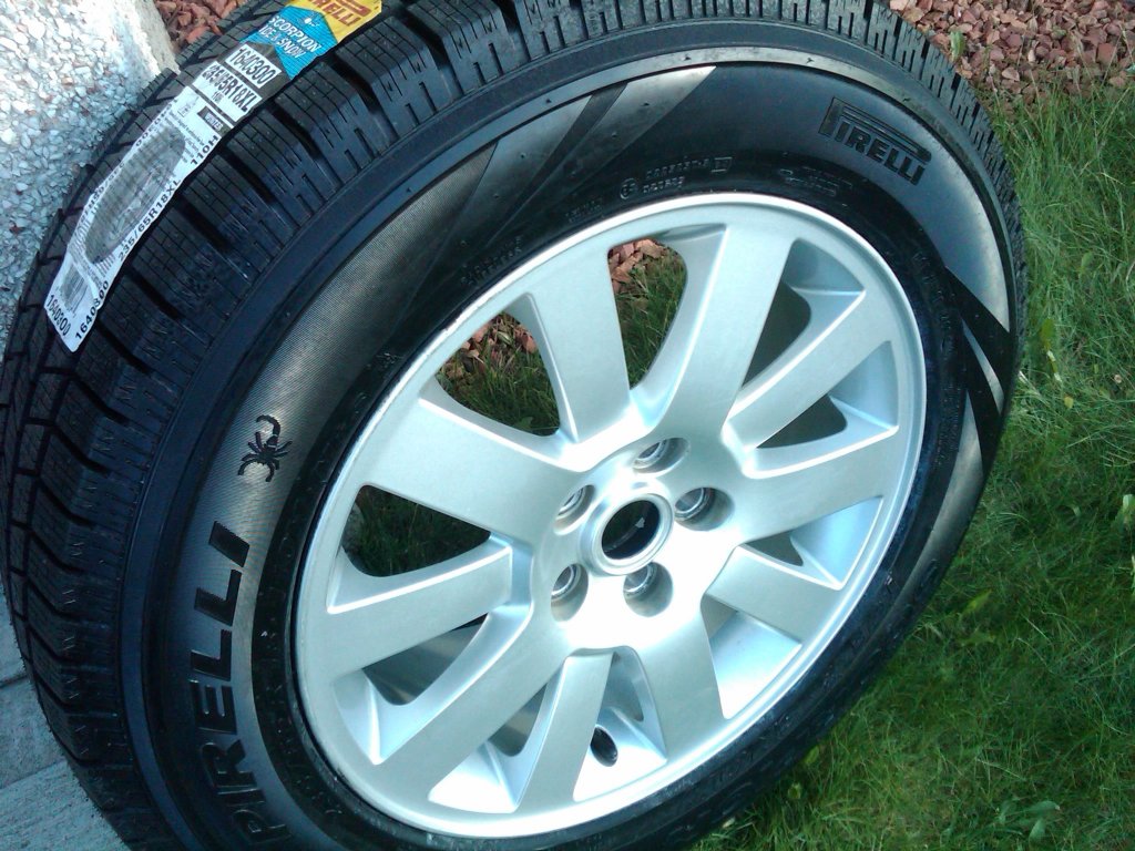 Pirelli Ice & Snow 235 65 R18 XL on 18 inch ten spoke rim.JPG